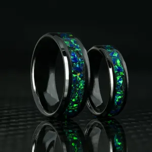 Matching Black Emerald Opal Glowstone Wedding Ring Set on Black Ceramic