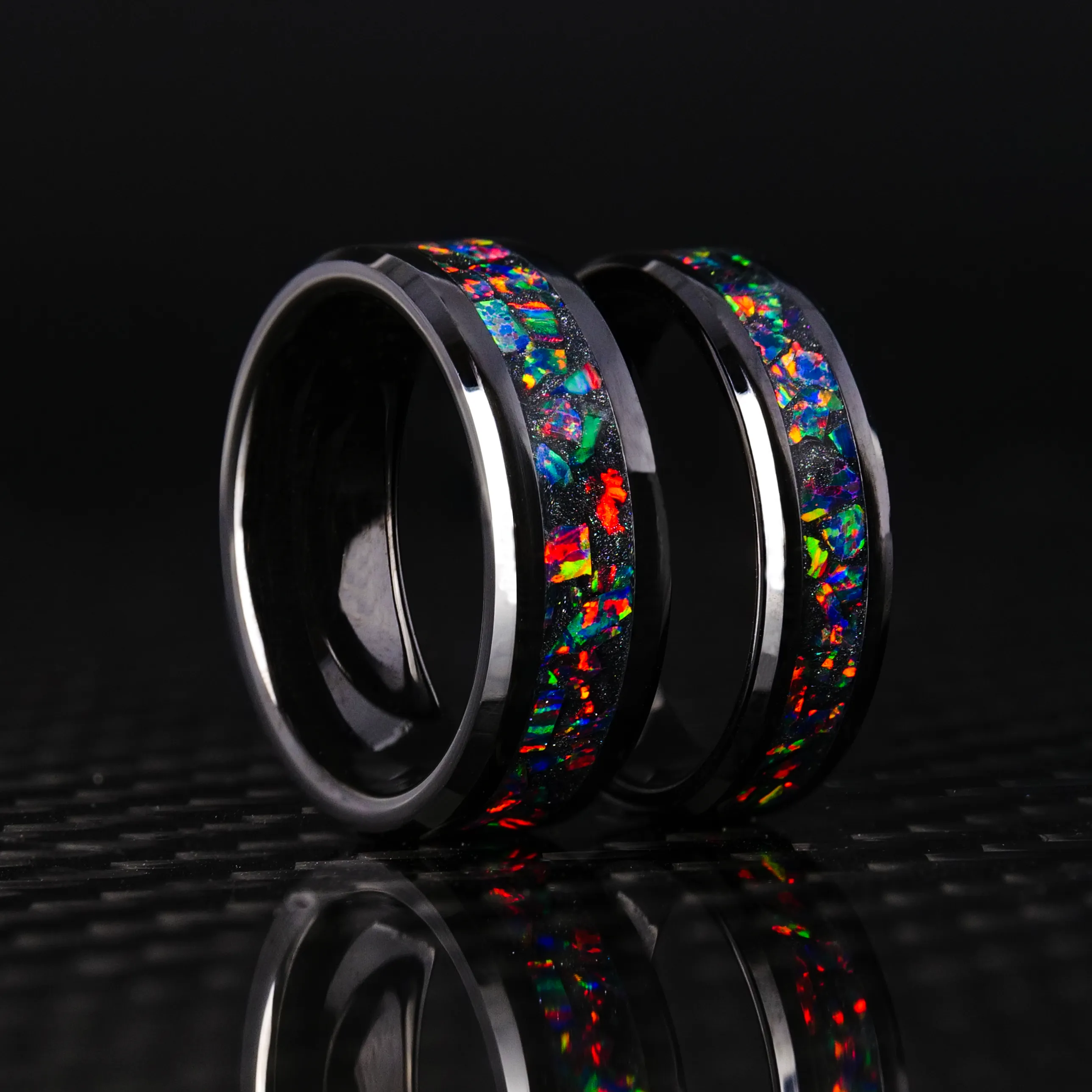 Matching Black Fire Opal Glowstone Wedding Ring Set on Black Ceramic